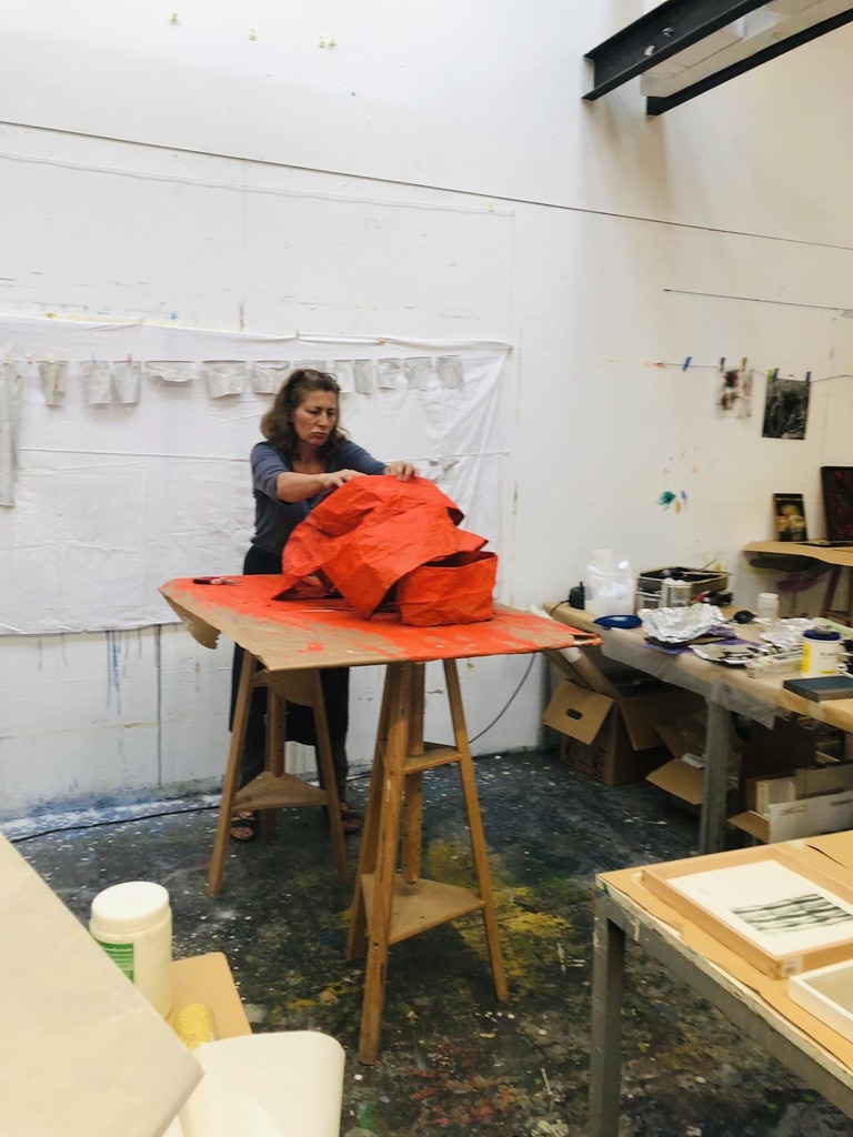 Susan Broy working on a sculpture in the studio