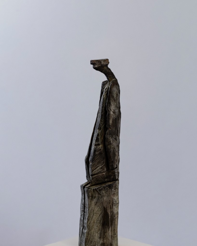 Stylized figure in a long coat